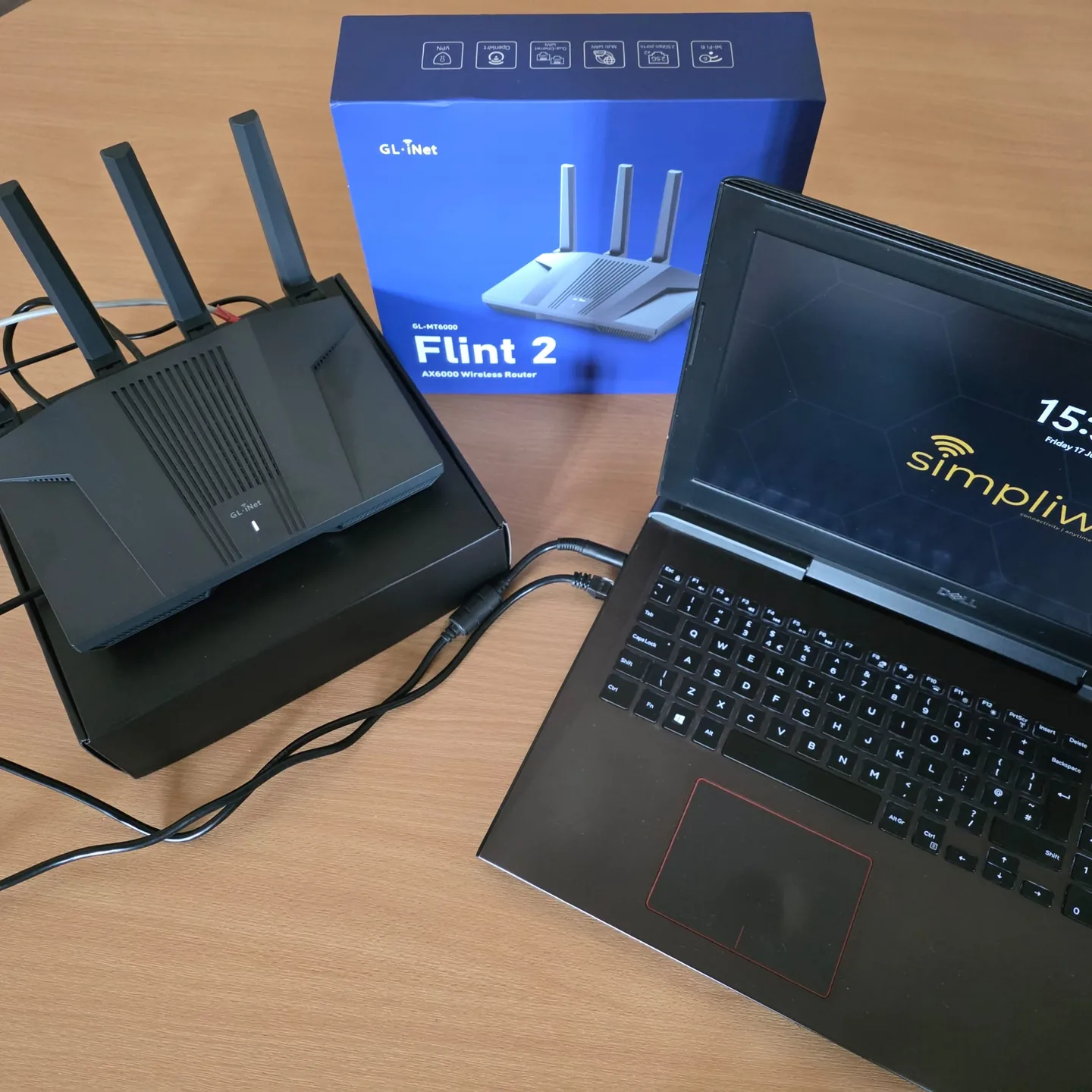 The GL.iNet GL-MT6000 Flint 2 unboxed, showing its ports and labels